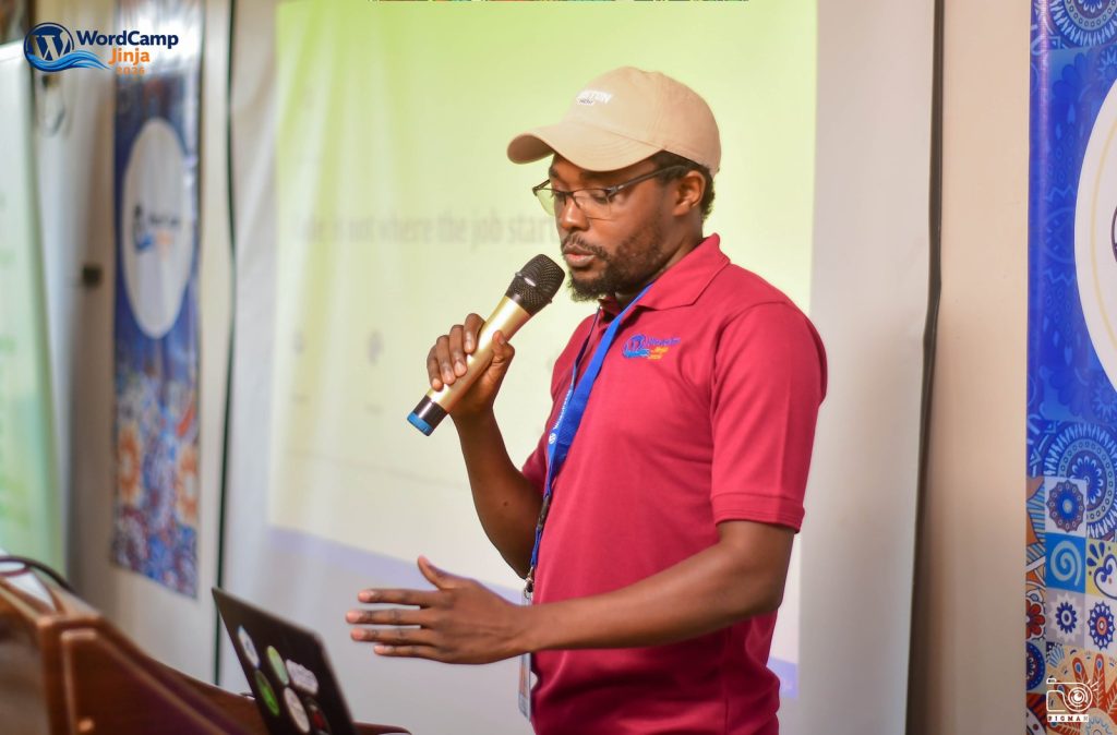 Rashid Migadde presenting "Real Challenges in WordPress Projects" at WordCamp Jinja 2026
