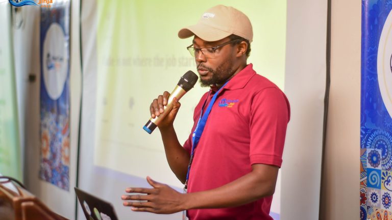 Rashid Migadde presenting "Real Challenges in WordPress Projects" at WordCamp Jinja 2026