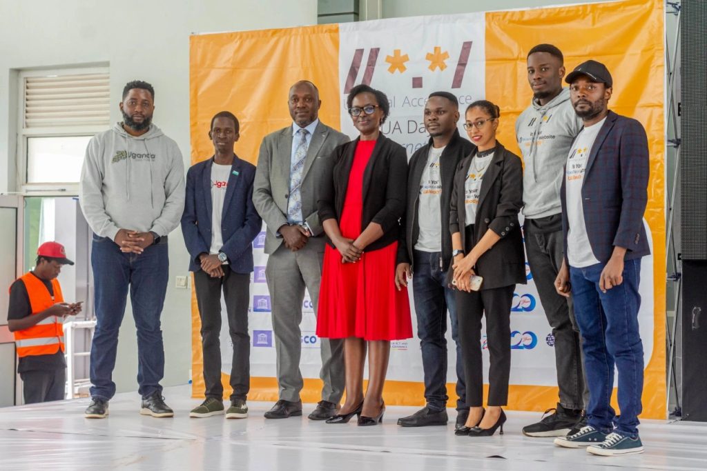 Rashid Migadde with speakers and organisers on stage at UA Day 2026 Uganda