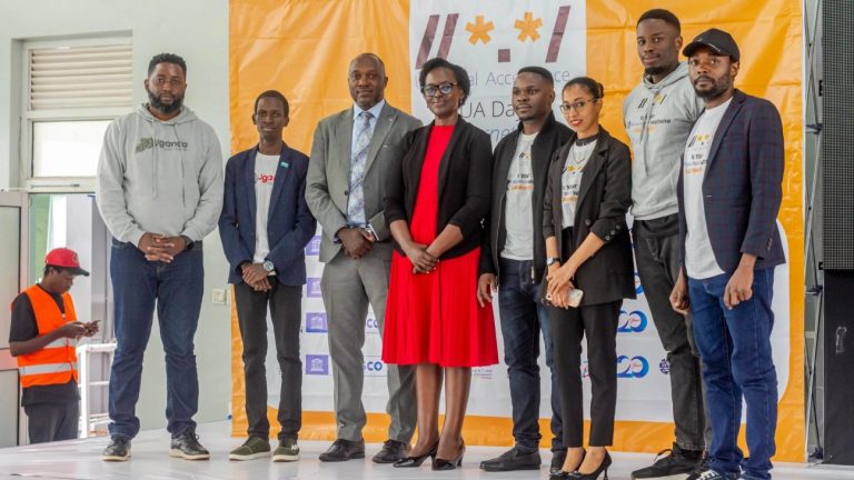 Rashid Migadde with speakers and organisers on stage at UA Day 2026 Uganda