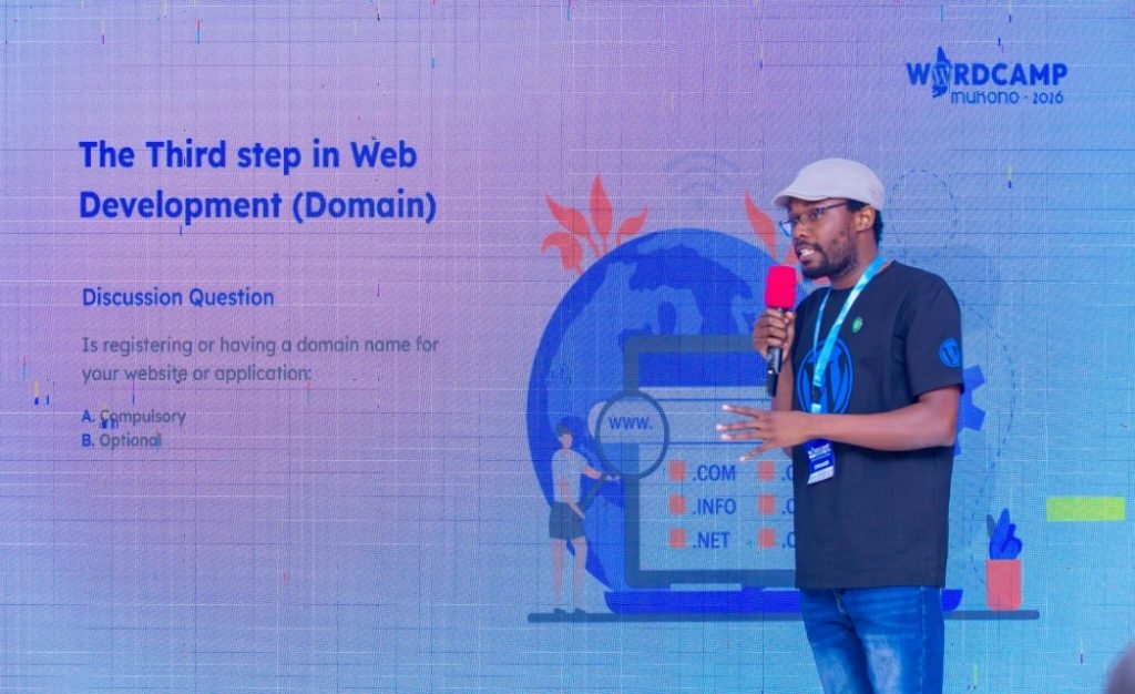 Rashid Migadde presenting "The Third Step in Web Development (Domain)" at WordCamp Mukono 2026